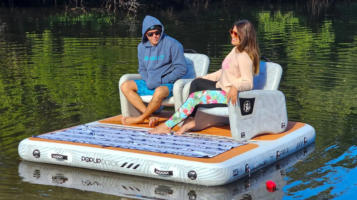 Inflatable popup dock with chairs on lake - water adventure platform